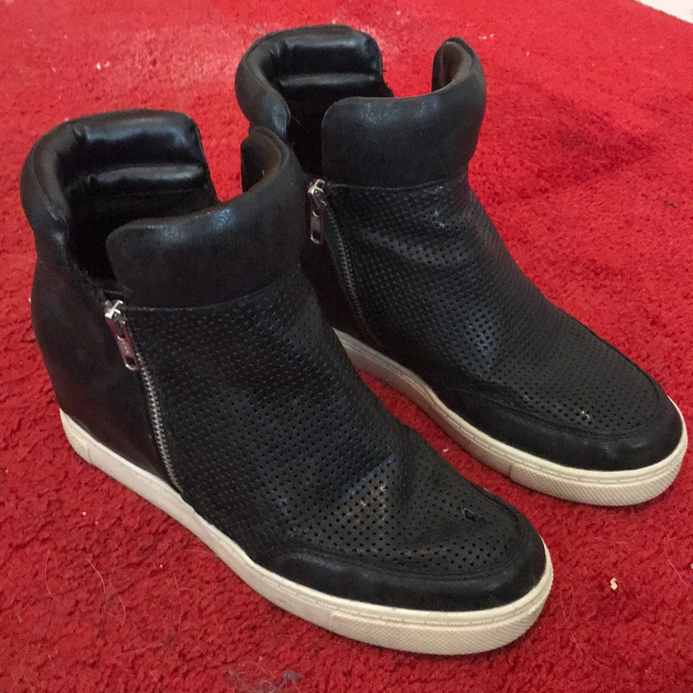 Black platform sneakers with white edge